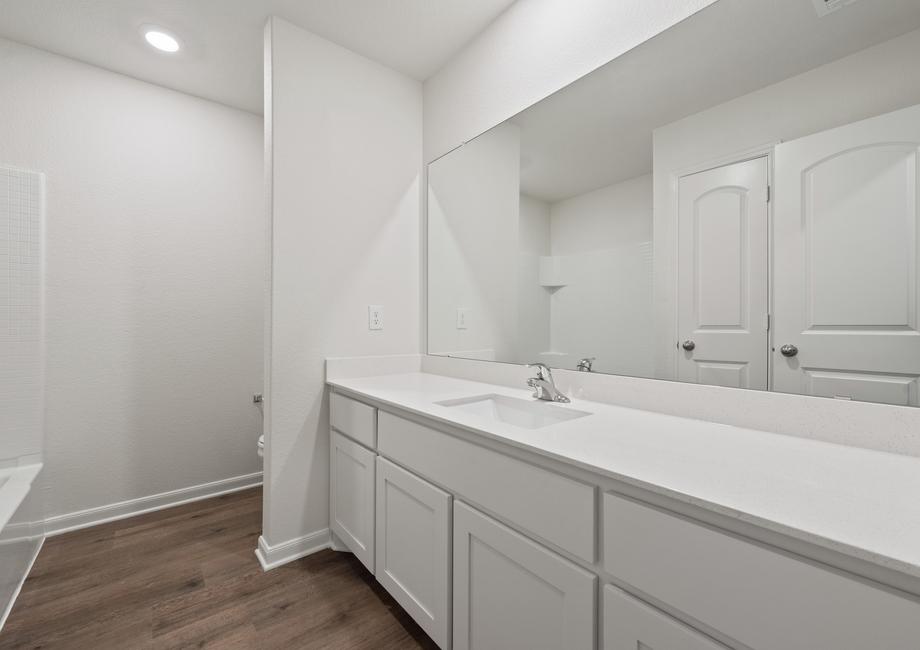 The secondary bathroom of the Reed has a large vanity with plenty of counterspace.