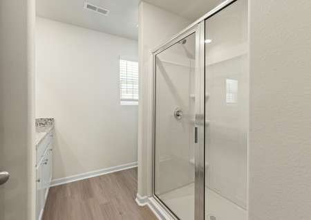 This bathroom has a glass-enclosed shower.