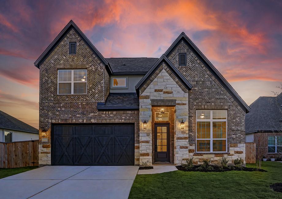 Dusk exterior of the Saurel plan, showcasing the exceptional exterior appeal.