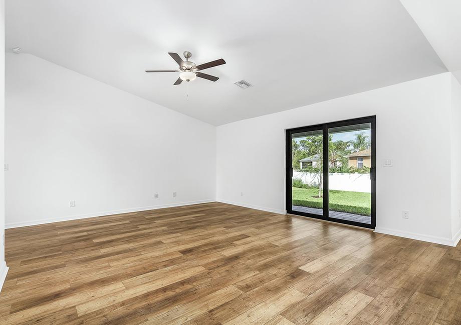 The family room is spacious and has a sliding door to the backyard