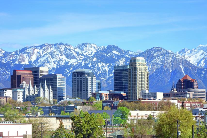 Salt Lake City skyline with mountains in the background.