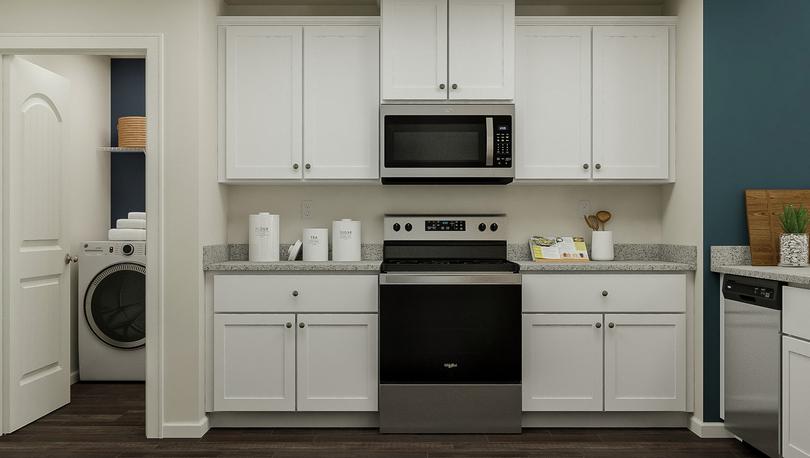 Rendering of the kitchen showcasing the
  white cabinetry, granite countertops and stainless steel appliances.