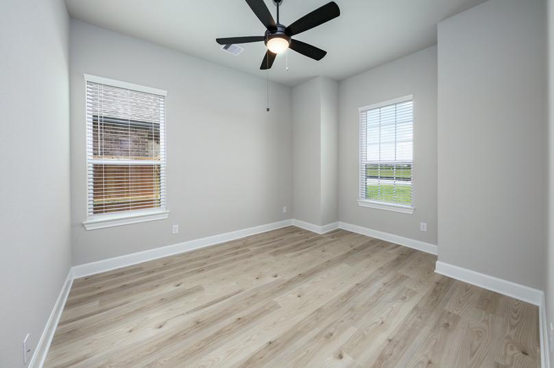The flex room is located off the entry and is the ideal space for a home office.