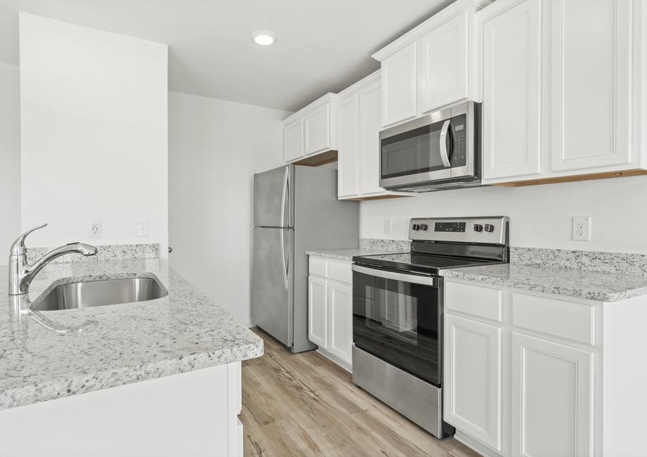 Enjoy a kitchen filled with stainless steel appliances and granite countertops
