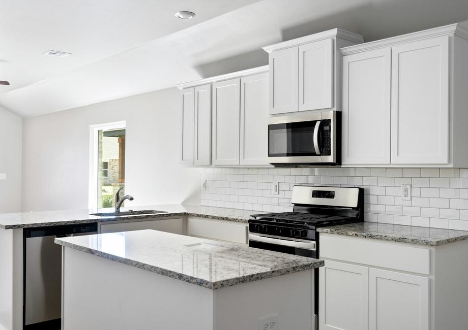 The kitchen of the Alfalfa has beautiful white cabinets.