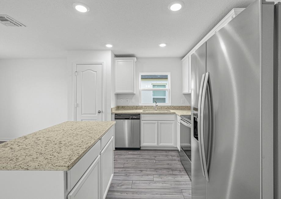 Stainless steel appliances and granite counters in the kitchen