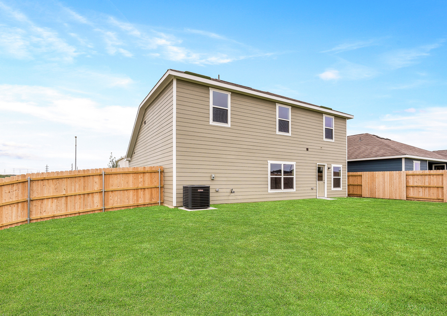 The back yard of the Cypress is fully fenced in.