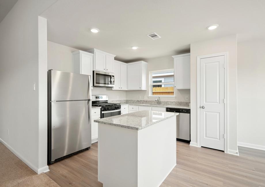 The chef ready kitchen has stainless steel appliances.
