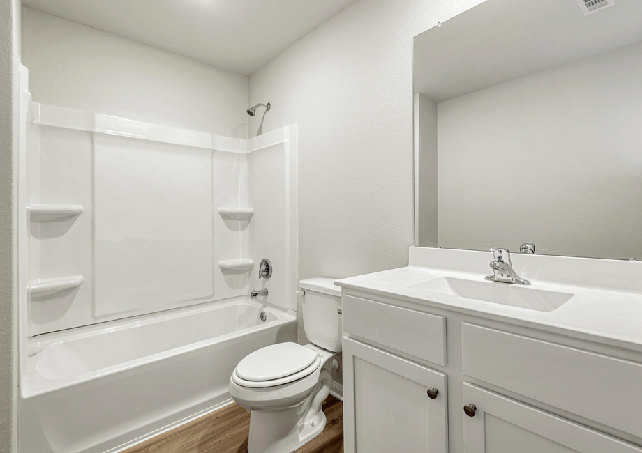 A secondary bathroom with a tub/shower combination