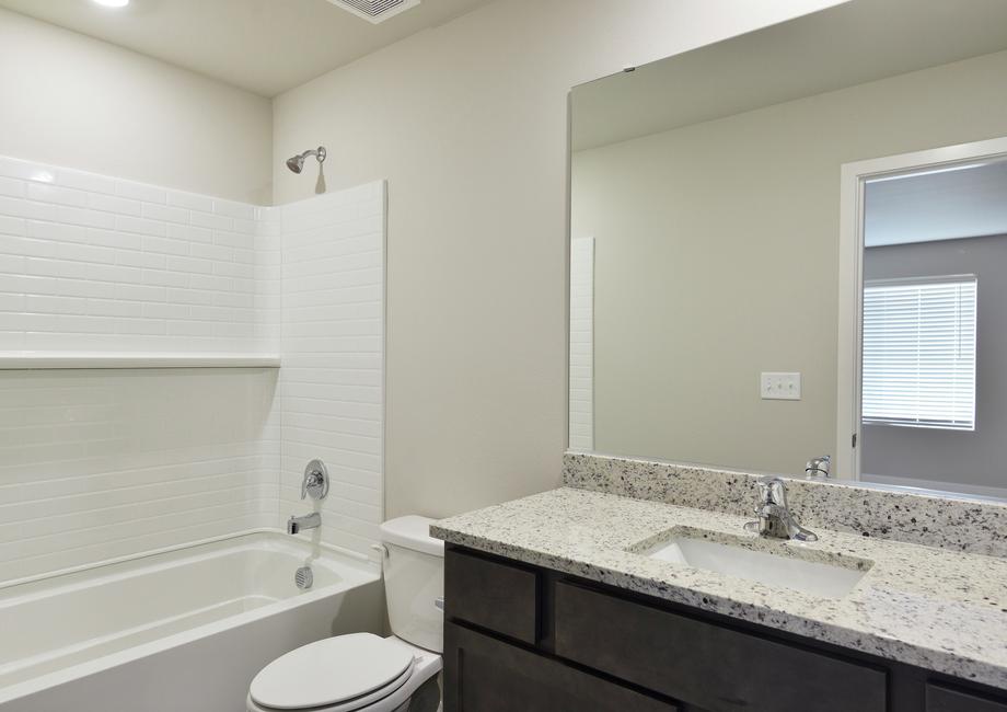 The secondary bathroom has a tub/shower combo.