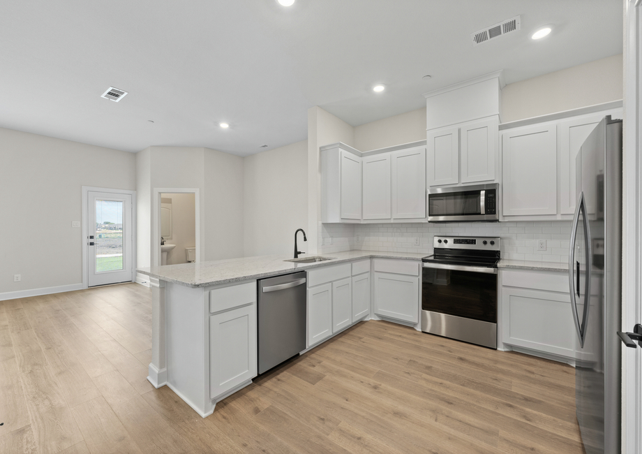 The kitchen of the Blazer has gorgeous white cabinetry.