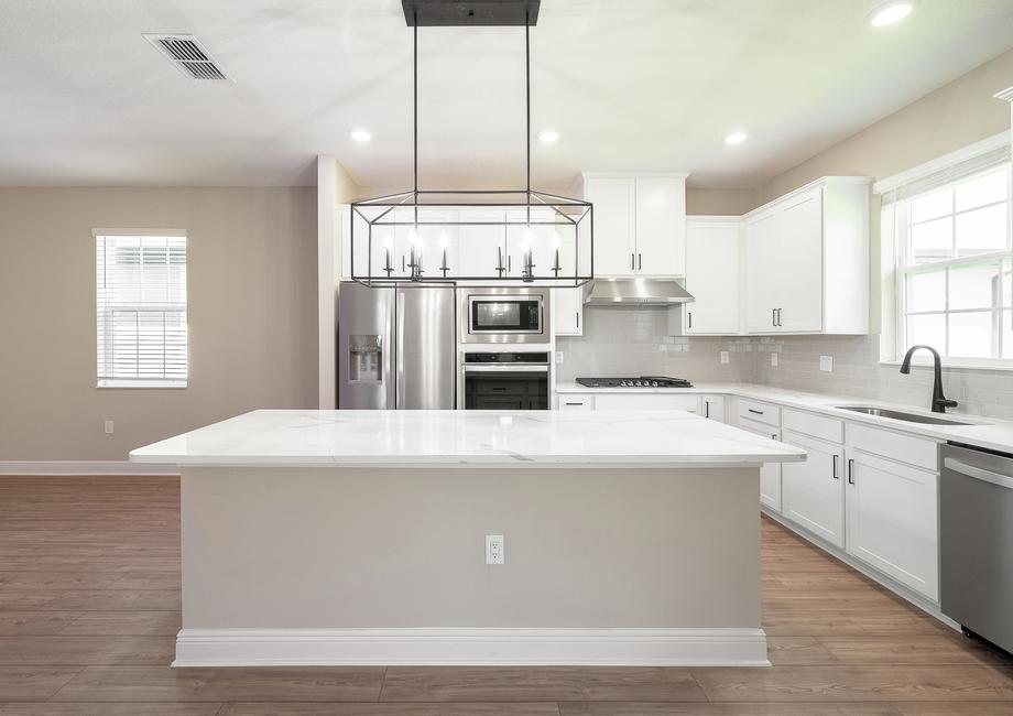 The large island in the center of the kitchen.