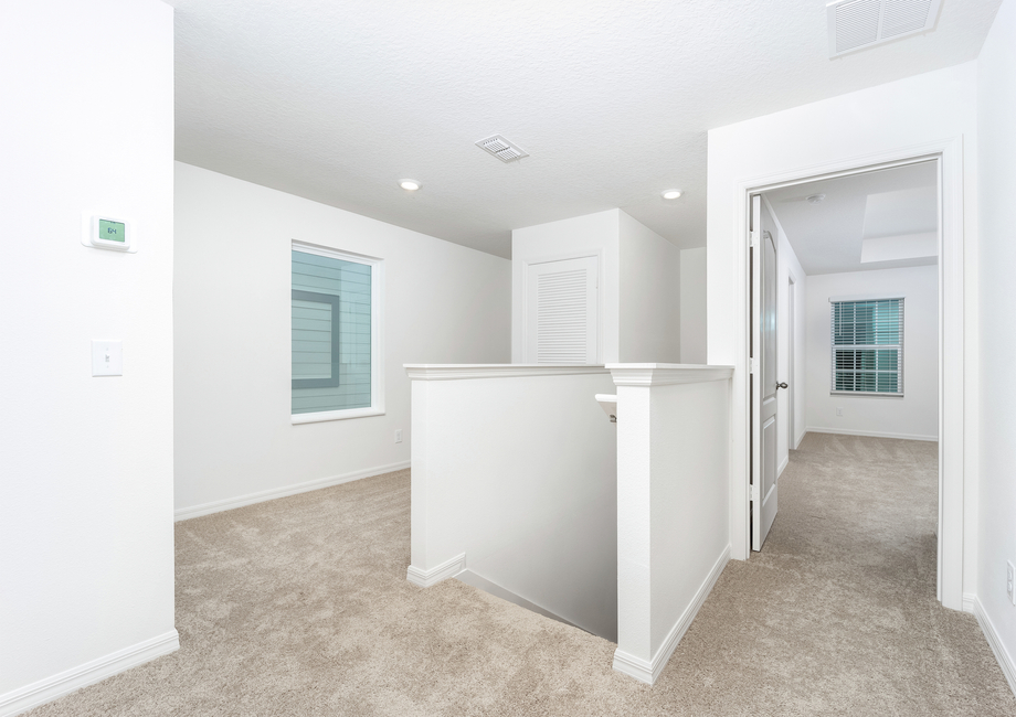 Upstairs loft with carpet is perfect for a office