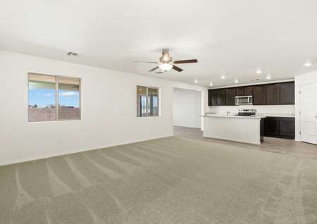 Open layout with a spacious family room and upgraded kitchen.