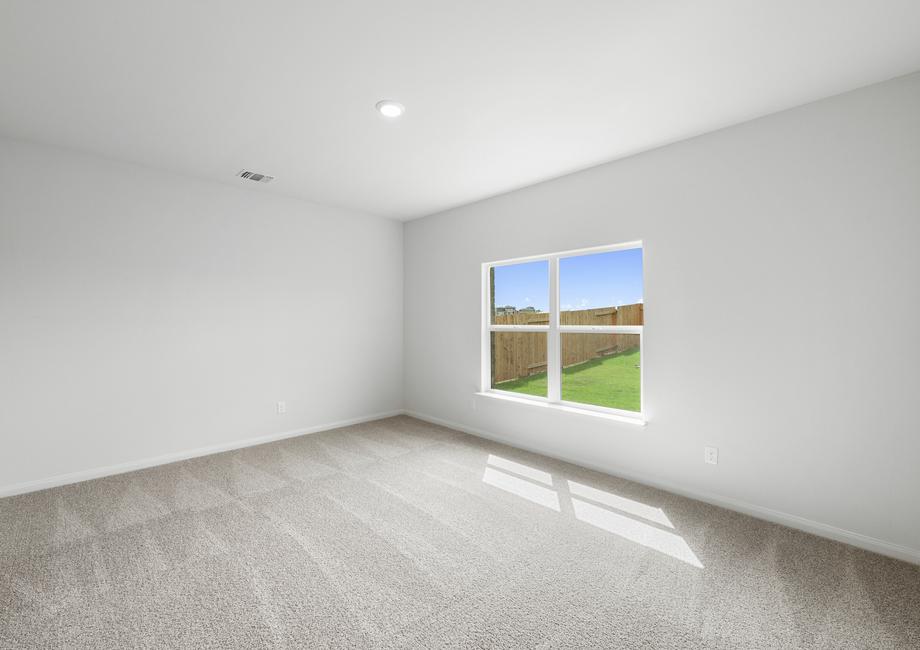 The master bedroom has a large window that lets in great, natural light.