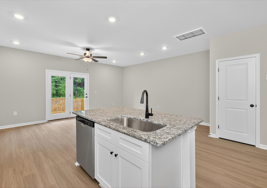 The dining room is off of the kitchen. 