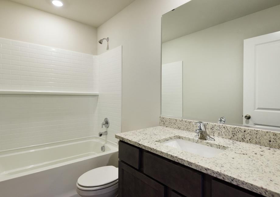 The secondary bathroom has a tub/shower combo.