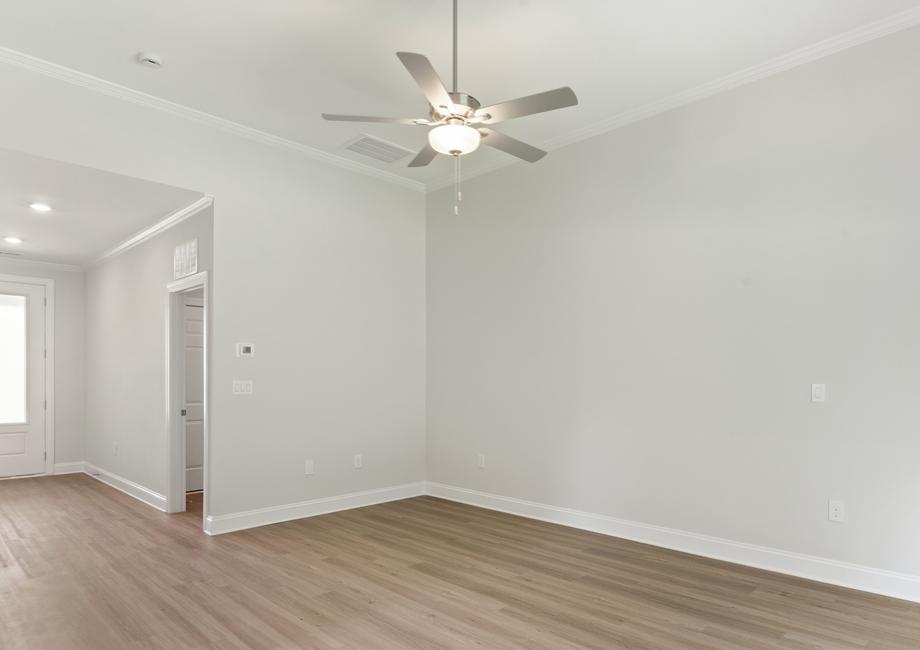 Family room with a ceiling fan and vinyl floors.