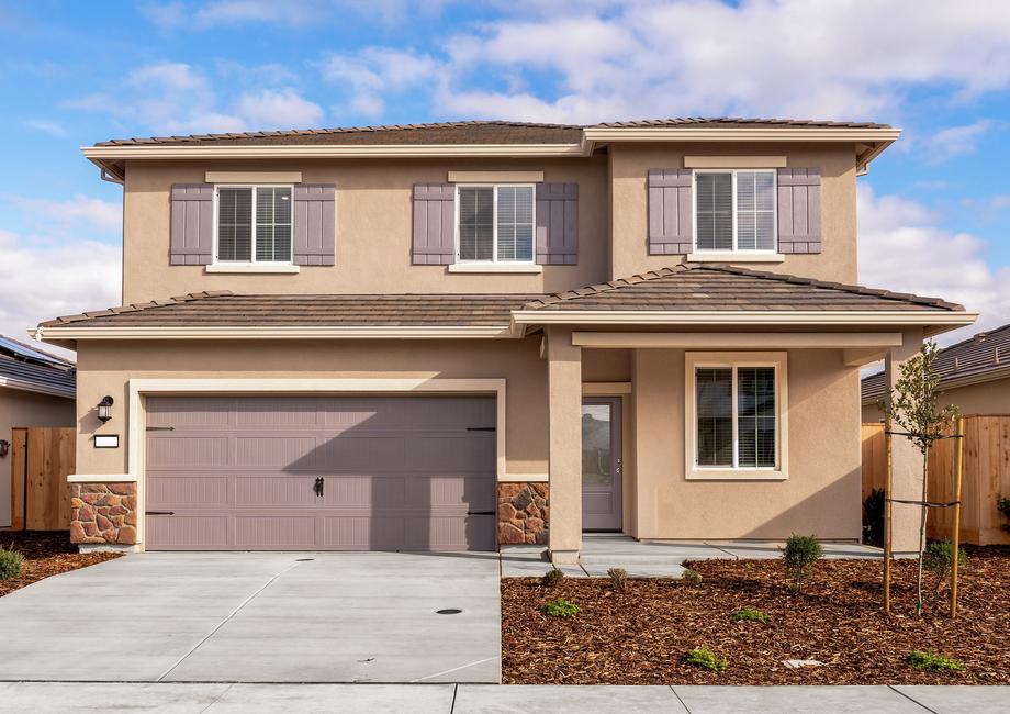 The Stallion is a beautiful home with stucco and stone.