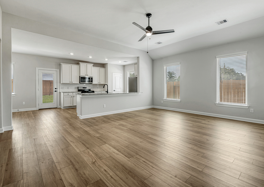 The kitchen and dining room overlook the family room