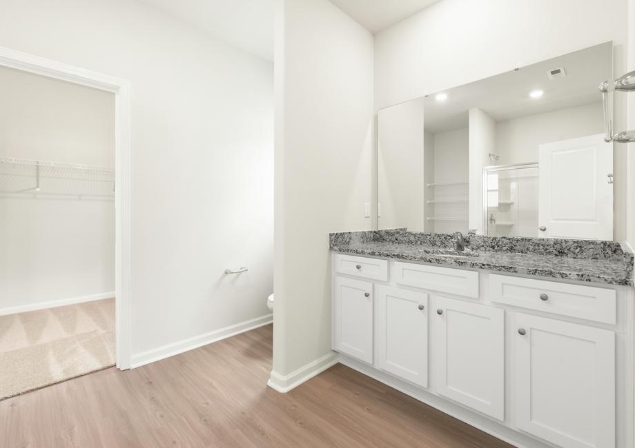 Master bath with a window and a vanity.