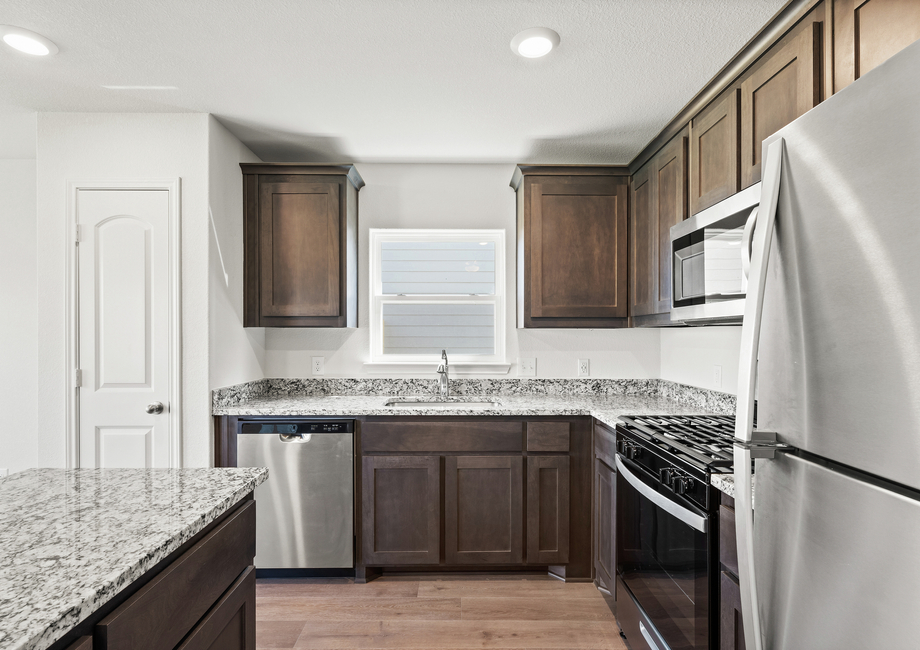 The gorgeous kitchen has energy-efficient, stainless-steel appliances.