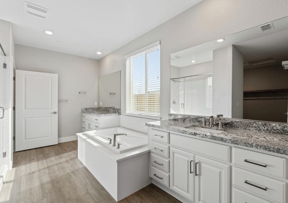 The master bath has a large soaker tub and separate shower.