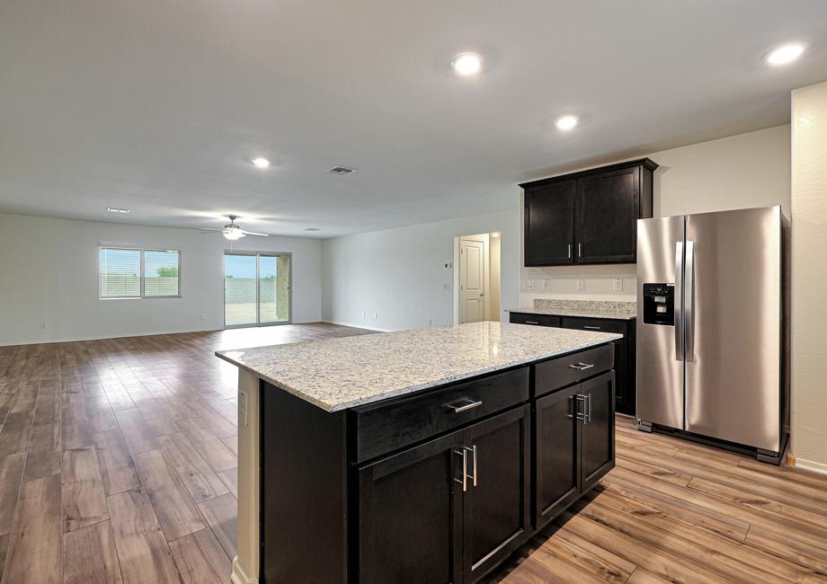 The kitchen overlooks the spacious living area.