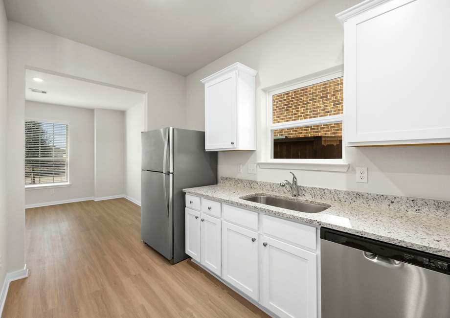 The kitchen has sprawling granite countertops.