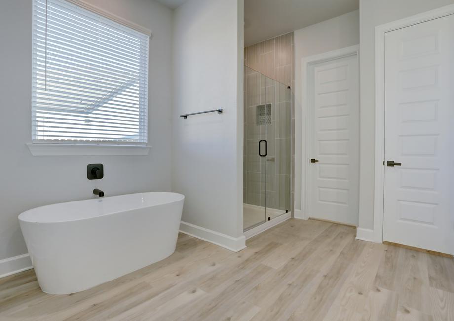 A soaking tub and walk-in shower provide a relaxing outlet to unwind.