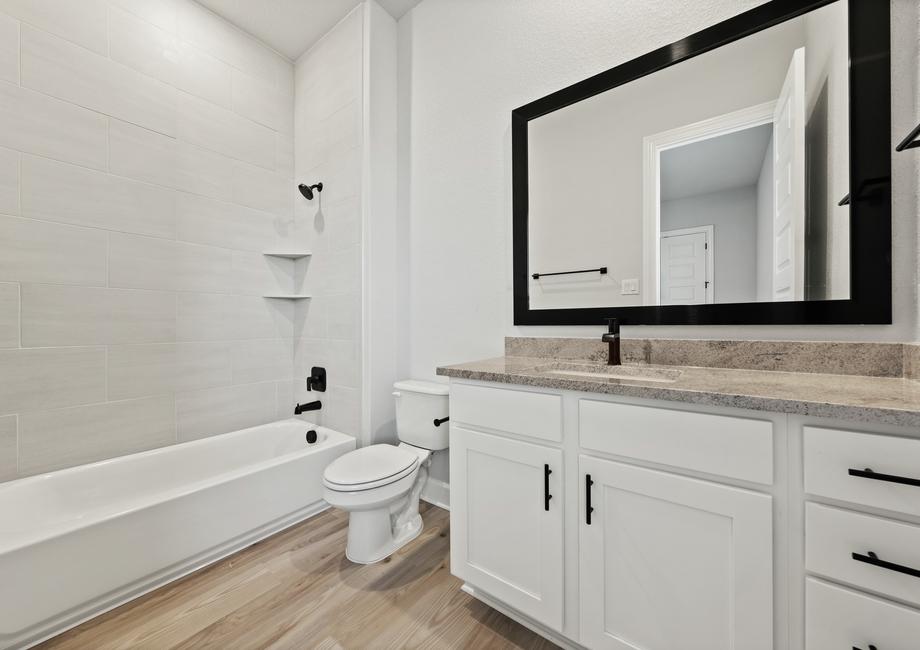 The secondary bathrooms are spacious and have fantastic storage under the vanity.