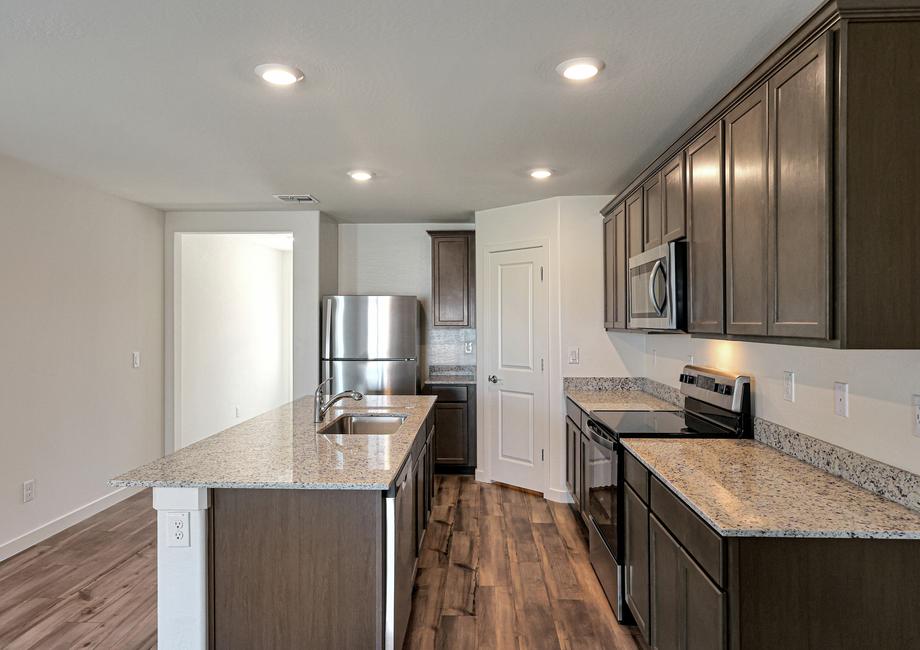 The kitchen comes with a full suite of stainless steel appliances!