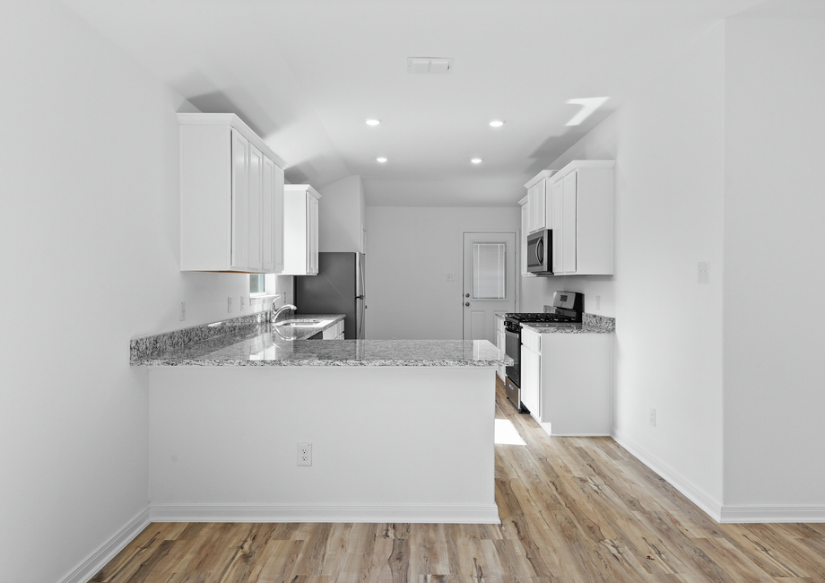 A chef-ready kitchen with white cabinets