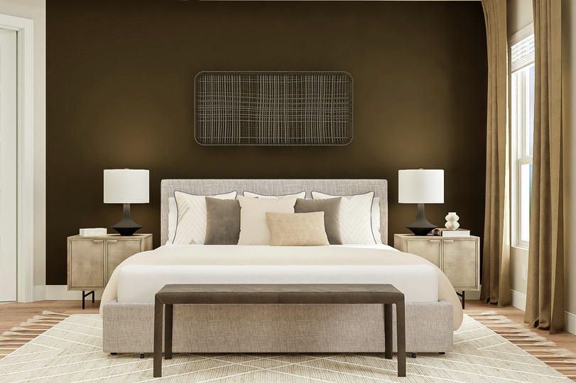Rendering of the master bedroom furnished
  with large bed with headboard, bench and rug. Two table lamps and a potted
  plant sit on nightstands in front of the brown accent wall.