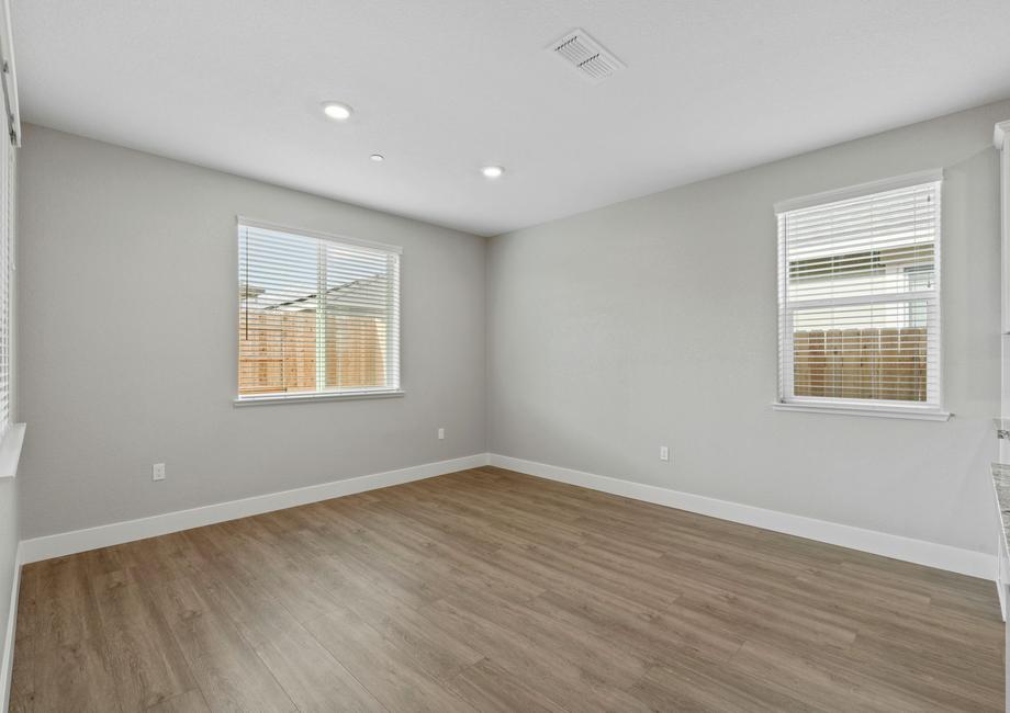 The dining room is open to the kitchen and family room.