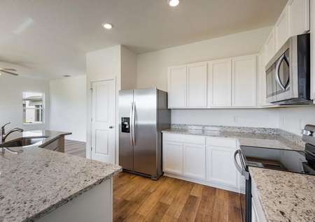 The kitchen comes chef-ready with stainless steel appliances