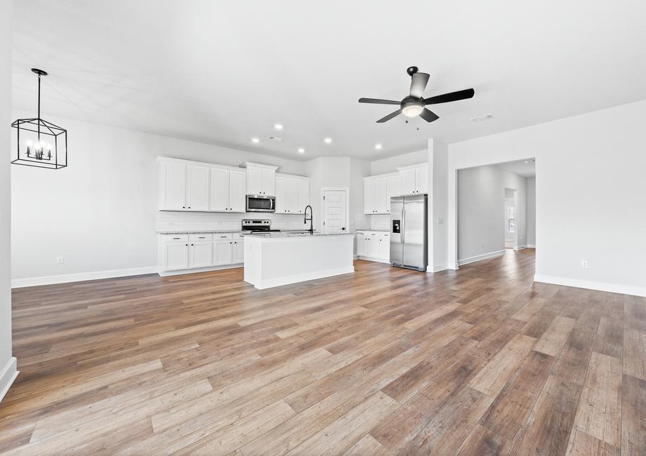 Additional view of the main living, kitchen and dining areas from the master bedroom door.