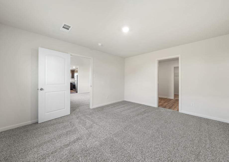 The master suite of the Sabine plan has a large room, private bathroom and walk-in closet.