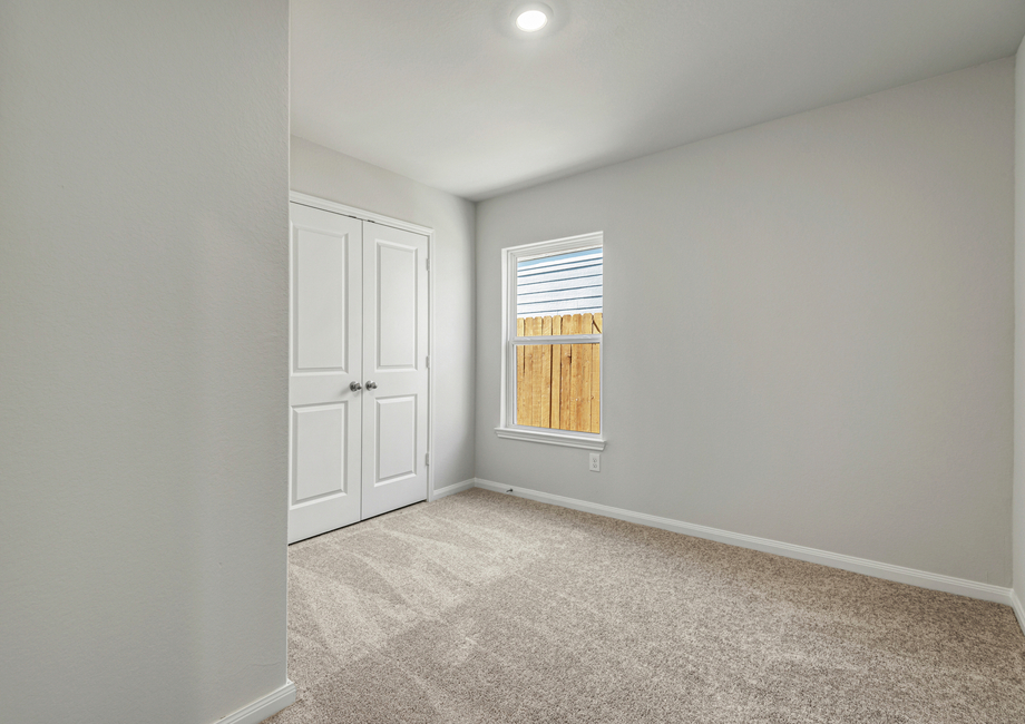 Guest bedroom with lush carpet