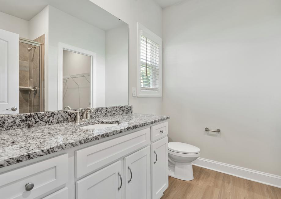 Master bath with a large white vanity.
