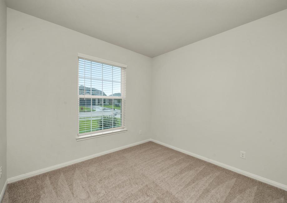 Spacious secondary bedroom with carpet