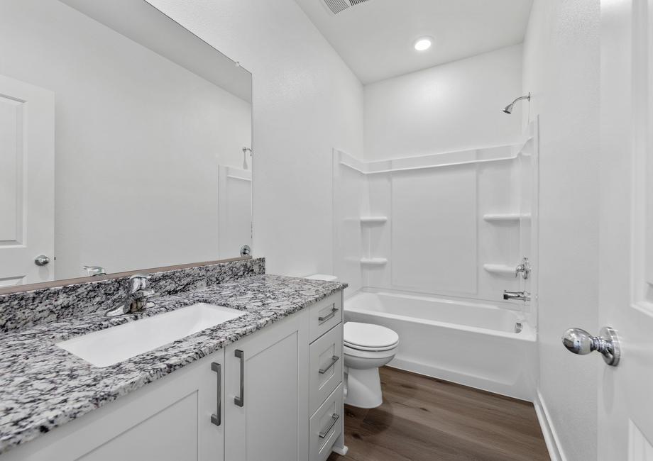 The secondary bathroom has a tub/shower combo.