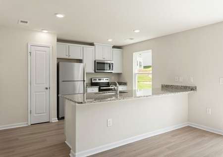 The kitchen has granite countertops and stainless steel appliances.