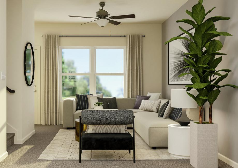 Rendering of the cozy living area with
  lots of natural light from the large window.