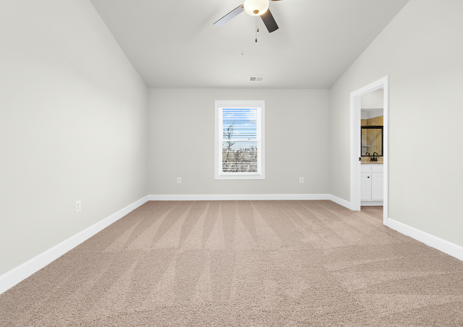 The master bedroom has an en-suite bathroom