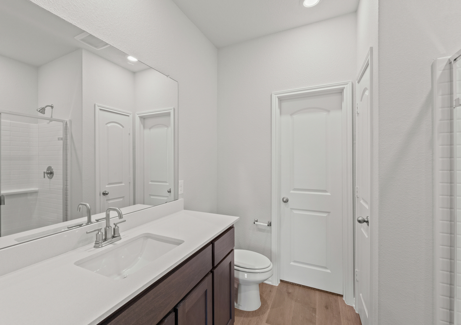 The master bathroom has a spacious vanity with plenty of counterspace.