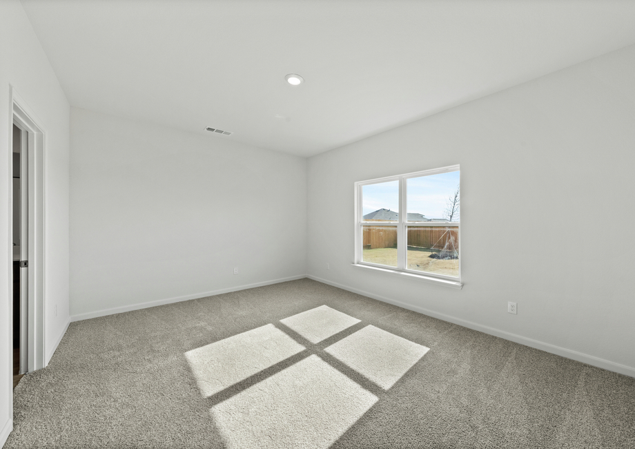 The master bedroom has a large window that lets in great, natural light.