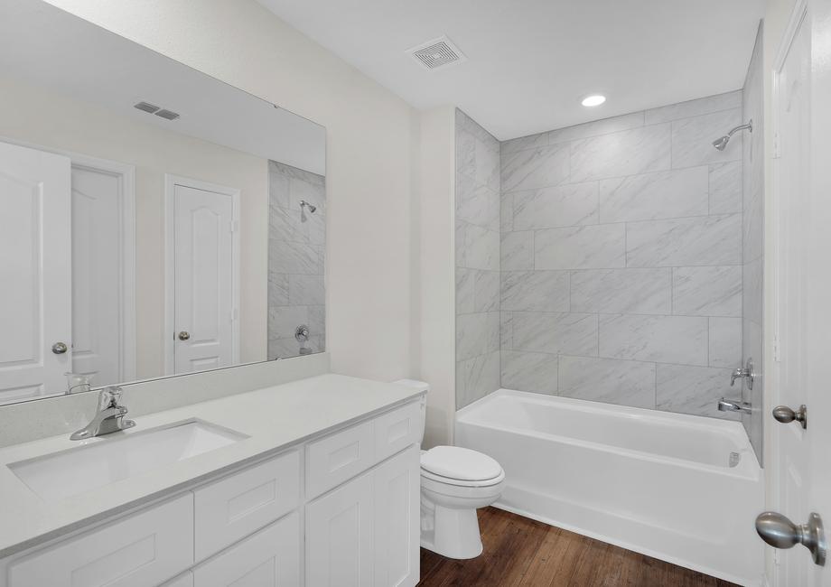 The master bathroom provides plenty of space to get ready in the mornings
