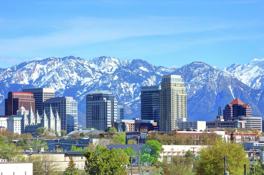 Salt Lake City skyline with mountains in the background.