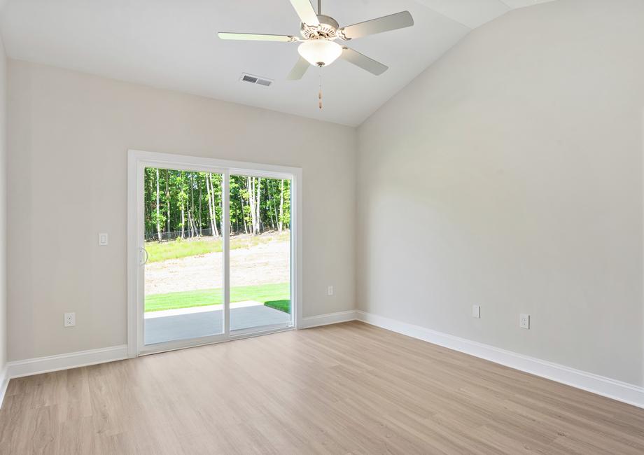 Family room with vinyl flooring and a ceiling fan.
